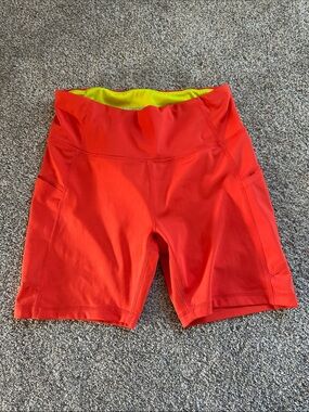 High-Waist Orange Athletic Bike Shorts with Neon Lining